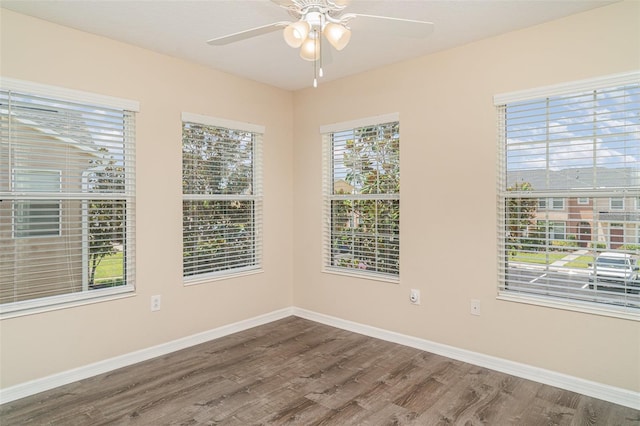 6920 Towering Spruce Dr, Riverview, FL 33578 - unfurnished room with wood finished floors, ceiling fan, and baseboards