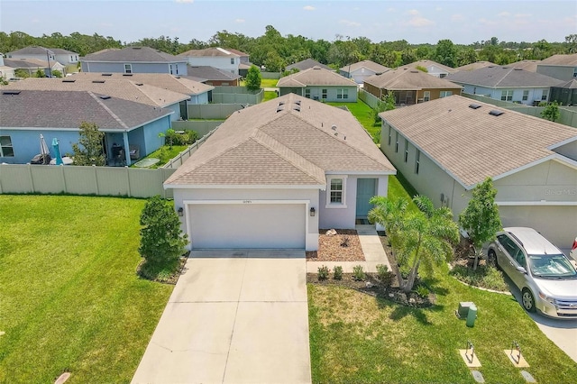 10945 High Noon Trl, Parrish, FL 34219 - view of front of home featuring a residential view, a garage, a shingled roof, concrete driveway, and stucco siding