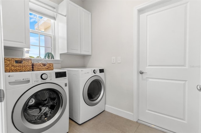 10945 High Noon Trl, Parrish, FL 34219 - laundry area with cabinet space, washing machine and dryer, baseboards, and light tile patterned flooring