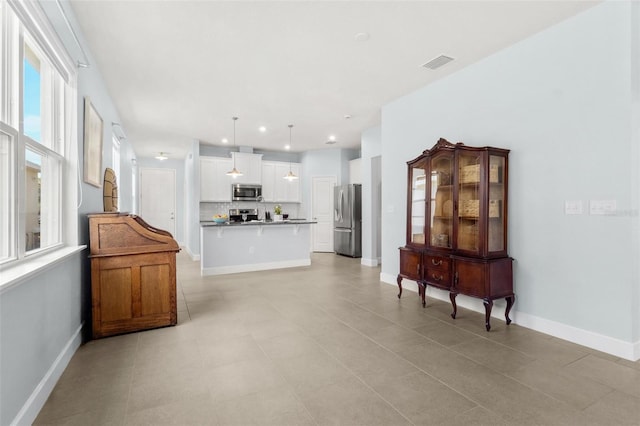 10945 High Noon Trl, Parrish, FL 34219 - living area featuring baseboards, light tile patterned floors, and recessed lighting