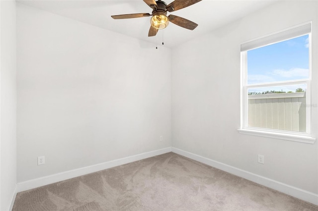 10945 High Noon Trl, Parrish, FL 34219 - spare room featuring light carpet, baseboards, and ceiling fan
