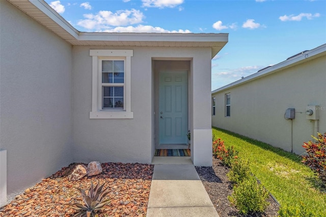 10945 High Noon Trl, Parrish, FL 34219 - doorway to property with stucco siding