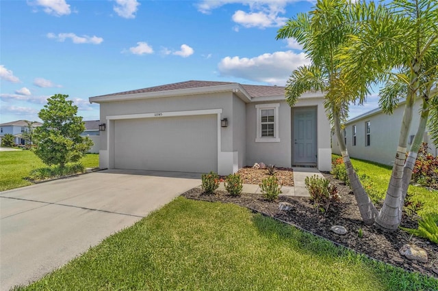10945 High Noon Trl, Parrish, FL 34219 - view of front of home featuring stucco siding, an attached garage, a front yard, and driveway