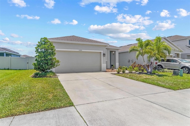 10945 High Noon Trl, Parrish, FL 34219 - view of front of home featuring stucco siding, a garage, and concrete driveway