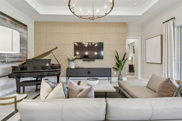 10036 Beachwalk Dr, Englewood, FL 34223 - living room with a tray ceiling, crown molding, a chandelier, and baseboards