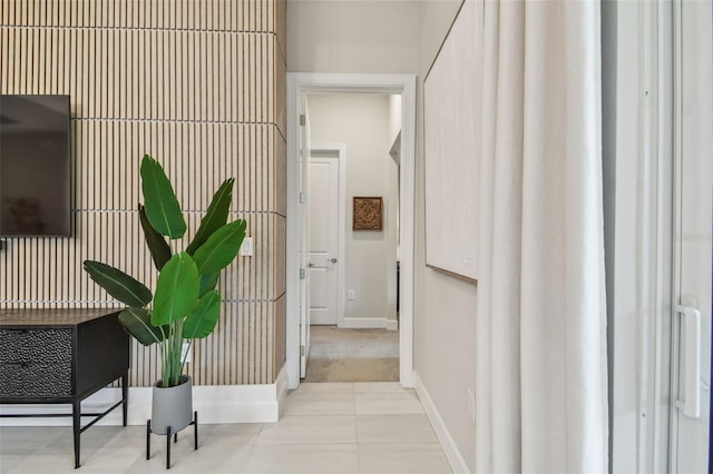 10036 Beachwalk Dr, Englewood, FL 34223 - hallway with baseboards and tile patterned floors