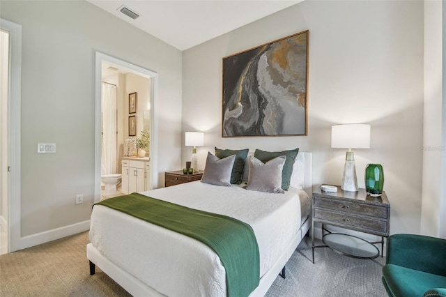 10036 Beachwalk Dr, Englewood, FL 34223 - bedroom featuring carpet floors, baseboards, and connected bathroom