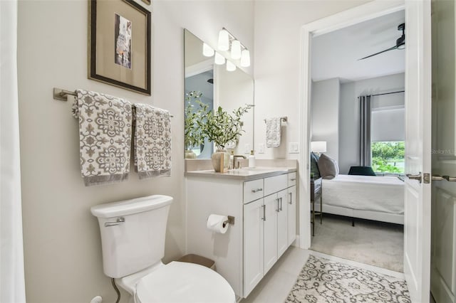 10036 Beachwalk Dr, Englewood, FL 34223 - bathroom featuring vanity, toilet, connected bathroom, and tile patterned floors