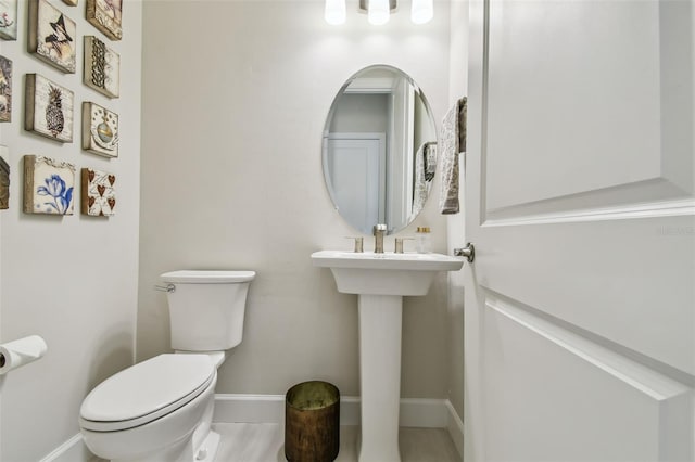 10036 Beachwalk Dr, Englewood, FL 34223 - half bath featuring toilet and baseboards