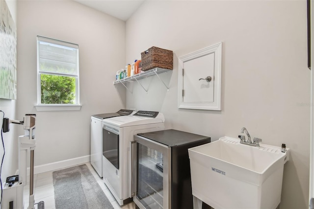 10036 Beachwalk Dr, Englewood, FL 34223 - washroom with independent washer and dryer and baseboards