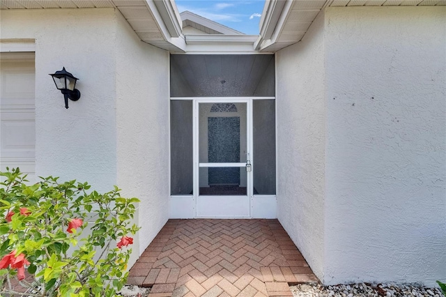 746 Masterpiece Dr, Sun City Center, FL 33573 - view of exterior entry featuring stucco siding