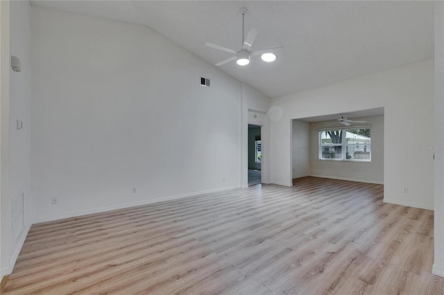 746 Masterpiece Dr, Sun City Center, FL 33573 - unfurnished living room with ceiling fan, light wood-type flooring, baseboards, and high vaulted ceiling