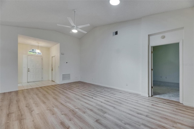 746 Masterpiece Dr, Sun City Center, FL 33573 - spare room with wood finished floors, vaulted ceiling, ceiling fan, and baseboards