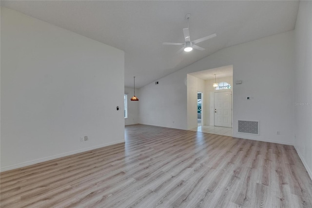 746 Masterpiece Dr, Sun City Center, FL 33573 - unfurnished living room featuring light wood-style floors, ceiling fan, baseboards, and high vaulted ceiling