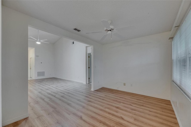 746 Masterpiece Dr, Sun City Center, FL 33573 - spare room with a ceiling fan, light wood-style floors, and baseboards