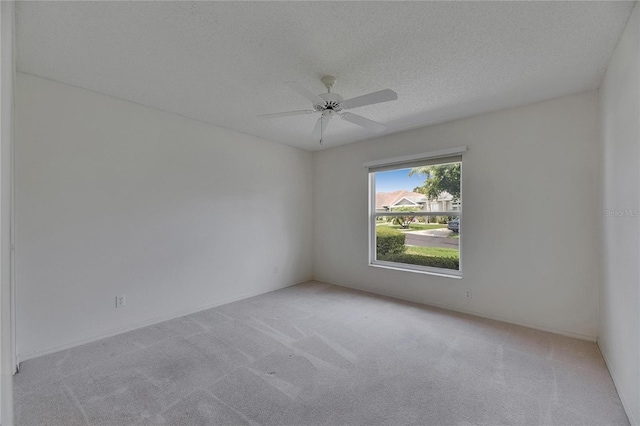 746 Masterpiece Dr, Sun City Center, FL 33573 - carpeted spare room with a ceiling fan and a textured ceiling