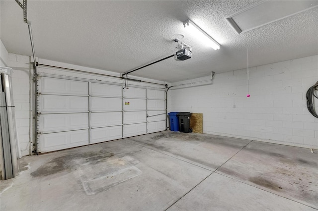 746 Masterpiece Dr, Sun City Center, FL 33573 - garage featuring a garage door opener and concrete block wall