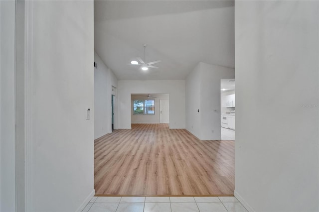 746 Masterpiece Dr, Sun City Center, FL 33573 - hall featuring wood finished floors and vaulted ceiling