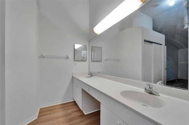 746 Masterpiece Dr, Sun City Center, FL 33573 - full bathroom featuring double vanity and wood finished floors
