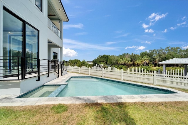 6520 Simone Shores Cir, Apollo Beach, FL 33572 - view of pool featuring a fenced backyard and a pool with connected hot tub