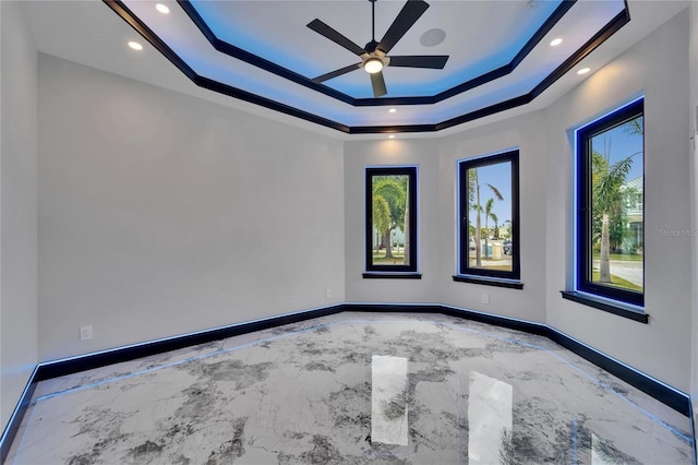 6520 Simone Shores Cir, Apollo Beach, FL 33572 - unfurnished room with a raised ceiling, a ceiling fan, marble tiled floors, baseboards, and recessed lighting