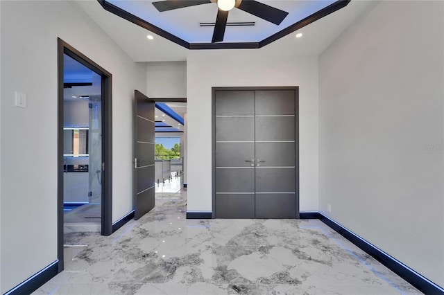 6520 Simone Shores Cir, Apollo Beach, FL 33572 - unfurnished bedroom featuring marble tiled flooring, a raised ceiling, recessed lighting, baseboards, and a ceiling fan