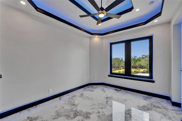6520 Simone Shores Cir, Apollo Beach, FL 33572 - spare room featuring a tray ceiling, a ceiling fan, marble tiled floors, recessed lighting, and baseboards