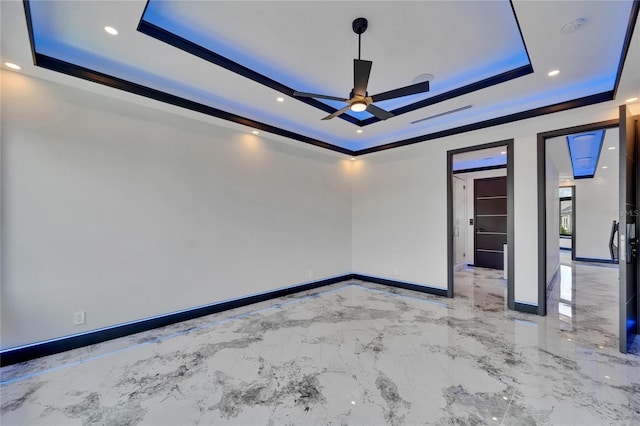6520 Simone Shores Cir, Apollo Beach, FL 33572 - empty room featuring a raised ceiling, a ceiling fan, baseboards, marble tiled floors, and recessed lighting