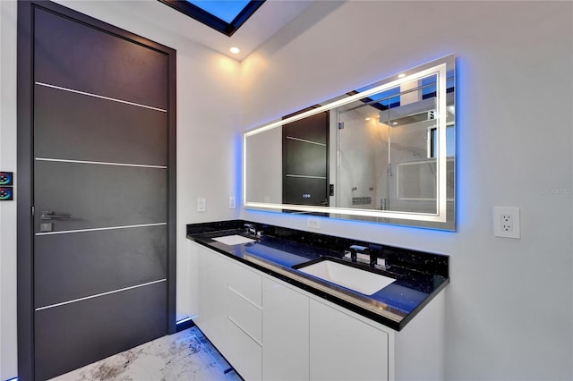 6520 Simone Shores Cir, Apollo Beach, FL 33572 - full bathroom featuring a shower stall, double vanity, and marble finish flooring