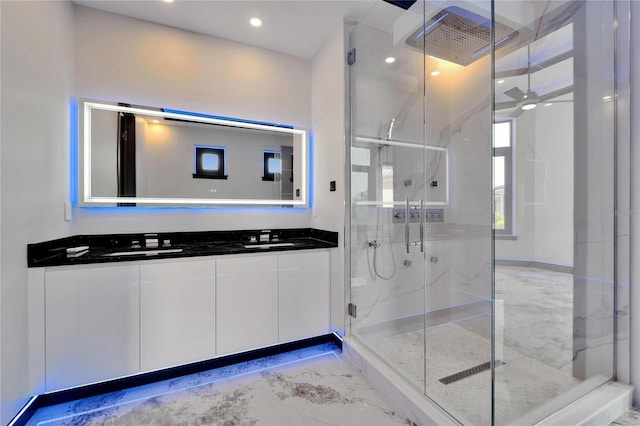 6520 Simone Shores Cir, Apollo Beach, FL 33572 - bathroom with marble finish flooring, double vanity, a marble finish shower, ceiling fan, and recessed lighting
