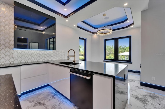 6520 Simone Shores Cir, Apollo Beach, FL 33572 - kitchen with dishwasher, backsplash, white cabinets, light marble finish floors, and a sink