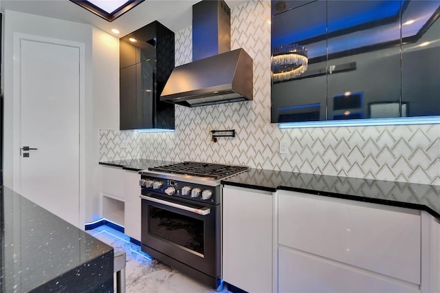 6520 Simone Shores Cir, Apollo Beach, FL 33572 - kitchen with range with gas stovetop, wall chimney range hood, light marble finish floors, decorative backsplash, and modern cabinets
