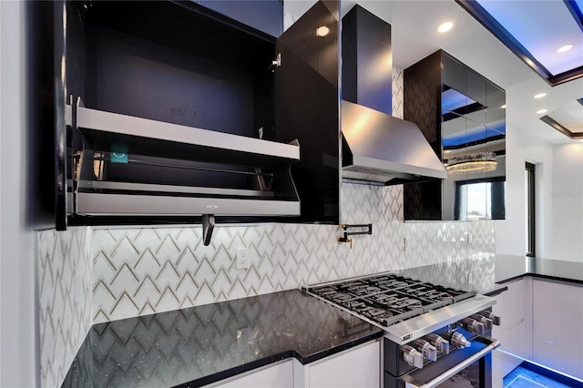 6520 Simone Shores Cir, Apollo Beach, FL 33572 - kitchen with high end range, wall chimney exhaust hood, tasteful backsplash, white cabinetry, and recessed lighting