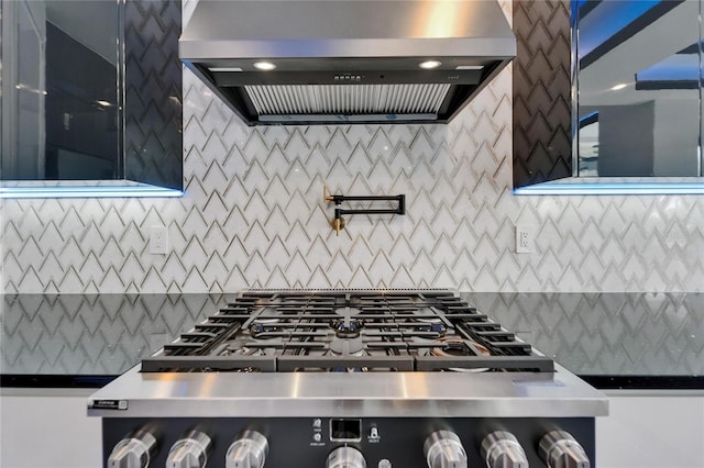 6520 Simone Shores Cir, Apollo Beach, FL 33572 - kitchen view of island exhaust hood, pot filler, tasteful backsplash, and range