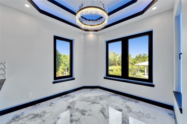 6520 Simone Shores Cir, Apollo Beach, FL 33572 - empty room with baseboards, marble tiled floors, recessed lighting, and a raised ceiling