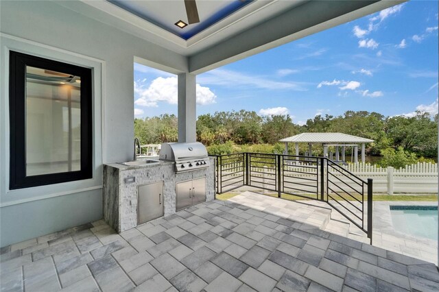6520 Simone Shores Cir, Apollo Beach, FL 33572 - view of patio featuring a sink, view of scattered trees, and a gazebo