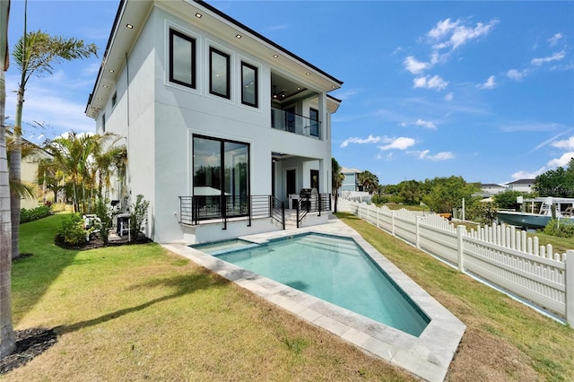 6520 Simone Shores Cir, Apollo Beach, FL 33572 - back of house featuring a balcony, stucco siding, and a patio
