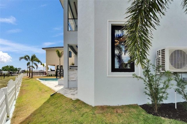 6520 Simone Shores Cir, Apollo Beach, FL 33572 - view of property exterior featuring ac unit, stucco siding, and a patio area