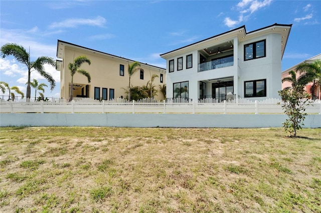 6520 Simone Shores Cir, Apollo Beach, FL 33572 - back of house with stucco siding and a balcony