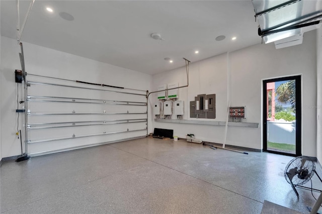 6520 Simone Shores Cir, Apollo Beach, FL 33572 - garage with recessed lighting, baseboards, and electric panel