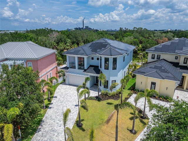 6520 Simone Shores Cir, Apollo Beach, FL 33572 - view of front facade with stucco siding, a garage, decorative driveway, and a front lawn