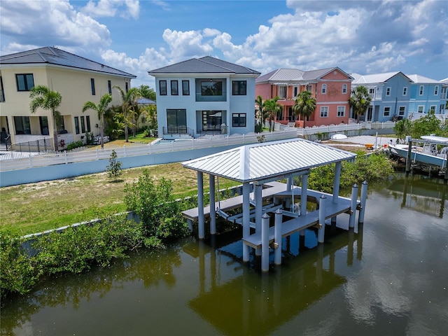 6520 Simone Shores Cir, Apollo Beach, FL 33572 - dock with boat lift, a water view, and a residential view