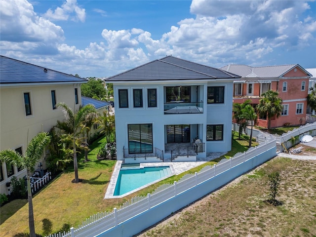 6520 Simone Shores Cir, Apollo Beach, FL 33572 - back of house featuring a balcony, stucco siding, and a patio