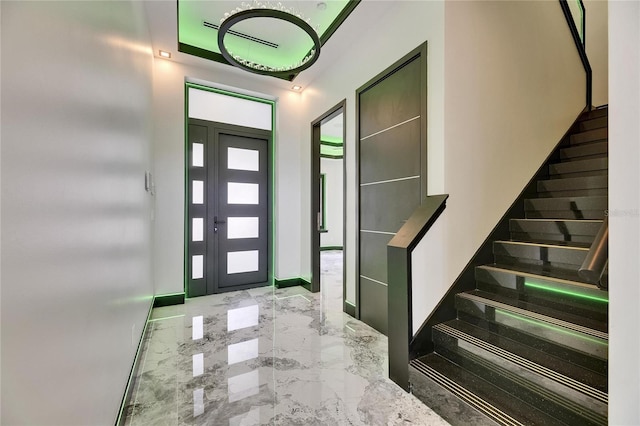 6526 Simone Shores Cir, Apollo Beach, FL 33572 - foyer entrance featuring stairs, marble tiled flooring, and baseboards