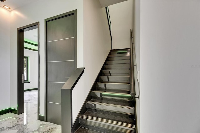 6526 Simone Shores Cir, Apollo Beach, FL 33572 - staircase with marble finish flooring and baseboards