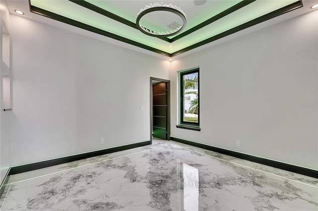 6526 Simone Shores Cir, Apollo Beach, FL 33572 - unfurnished room featuring a raised ceiling, baseboards, marble finish floors, and recessed lighting