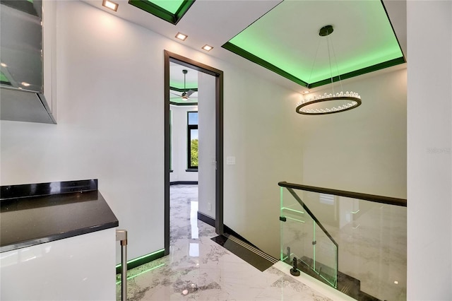 6526 Simone Shores Cir, Apollo Beach, FL 33572 - corridor featuring marble tiled flooring, baseboards, and a skylight