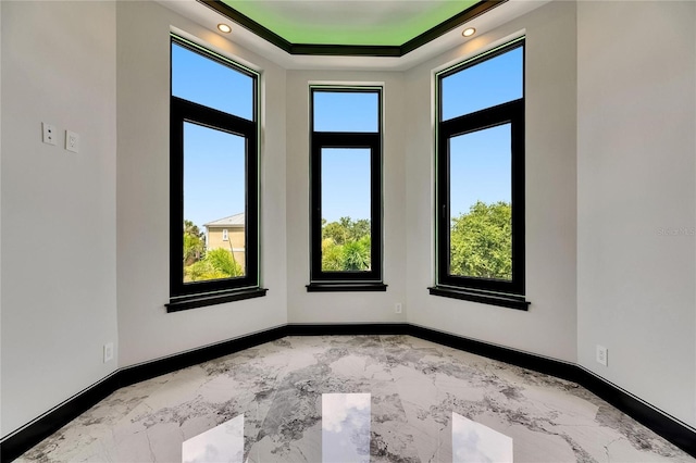 6526 Simone Shores Cir, Apollo Beach, FL 33572 - spare room featuring marble finish floors, baseboards, a raised ceiling, and recessed lighting