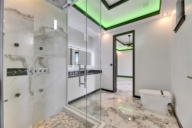 6526 Simone Shores Cir, Apollo Beach, FL 33572 - full bathroom with marble tiled floors, toilet, vanity, and a shower