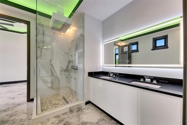 6526 Simone Shores Cir, Apollo Beach, FL 33572 - full bath with a marble finish shower, double vanity, marble finish flooring, and baseboards